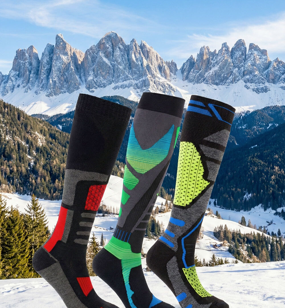 Calze tecniche Beneduci per sport invernali con sfondo di montagne innevate